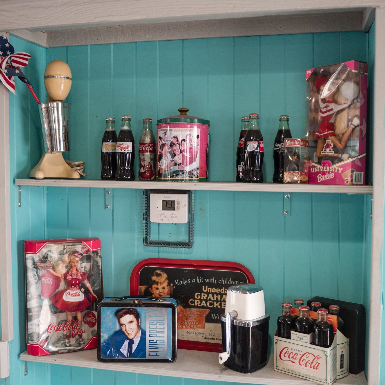 Vintage records and album covers on a teal wall