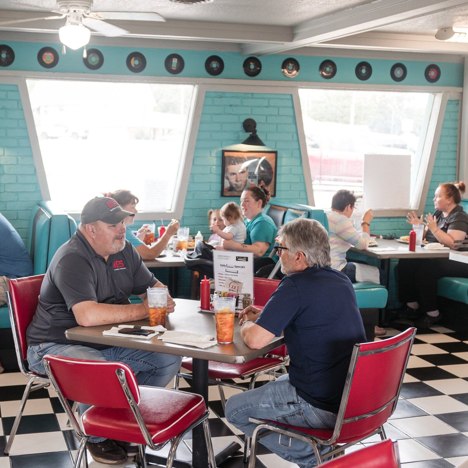 Friends sharing lunch at a booth